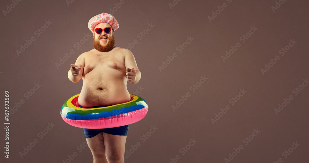 Funny bearded man prepared for beach vacation - obrazy, fototapety, plakaty 
