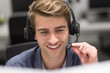 © .shock - male call centre operator doing his job