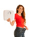 Beautiful young woman holding scale and too big trousers as she lost weight