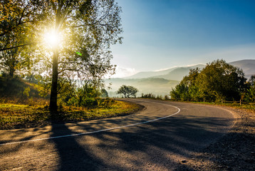 countryside road down to the valley at sunrise