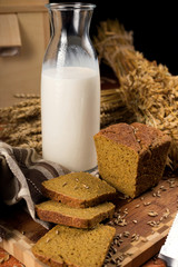 Wall Mural - Still life with a glass jug of milk, rye bread, ears of corn