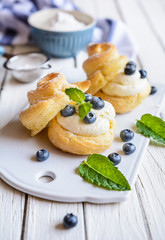 Wall Mural - Cream puffs filled with vanilla cream and blueberries