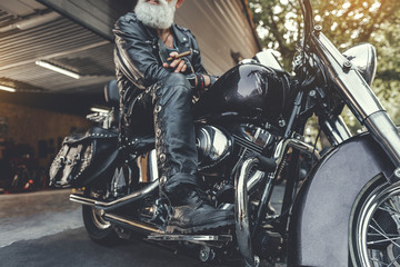 Canvas Print - Old bearded locating on motorbike