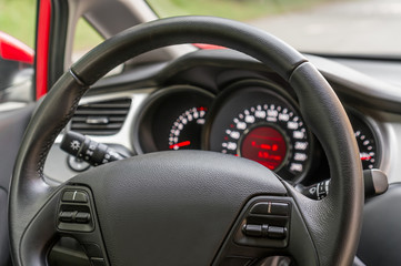 Car interior with steering wheel and dashboard