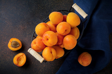 Delicious ripe apricots on a dark background. Selective focus. Top view. copy space.