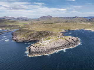 Stunning aerial shot of Ardnamurchan Point, Great Britains most westerly point, with lighthosue and the beautiful white beaches and costline in the background