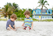 Two Little Kids Boys Having Fun On Tropical Beach