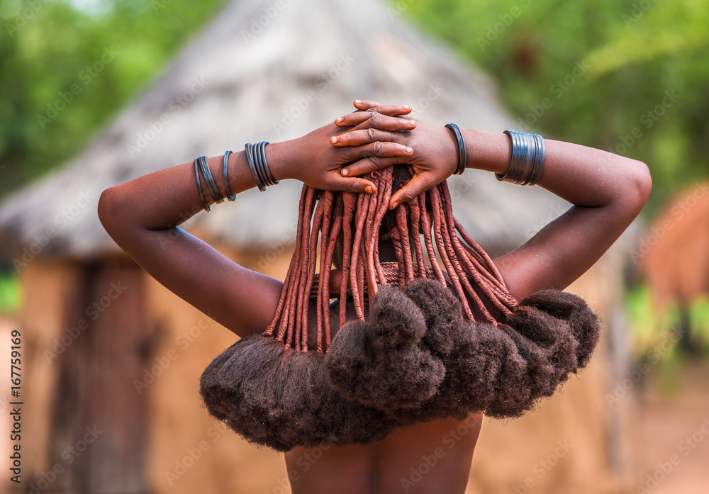 Hair style of Himba women, tribespeople living in northern Namibia - obrazy, fototapety, plakaty 