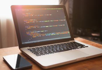 Computer code on laptop (web developing)