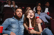 © Drobot Dean - Surprised young couple sitting at the cinema