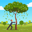 Businessman shaking tall cash tree with banknotes