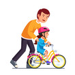 Caring dad teaching daughter to ride bike