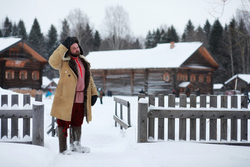 Wall Mural - Traditional winter costume of peasant medieval age in russia