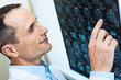 © Viacheslav Yakobchuk - Handsome doctor comparing computer tomography results