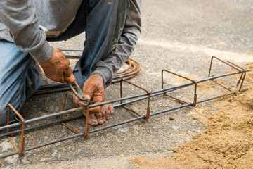 Labor is tying steel for construction site