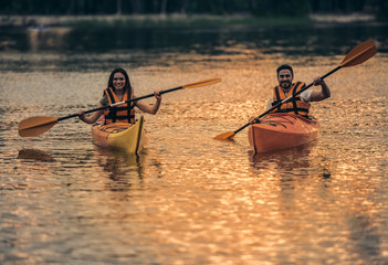 Wall Mural - Couple travelling by kayak