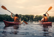 Couple Travelling By Kayak