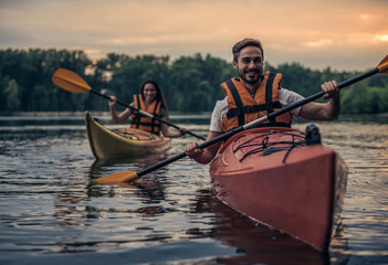 Wall Mural - Couple travelling by kayak