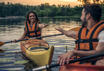 Wall Mural - Couple travelling by kayak