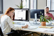 © ALTO IMAGES/Stocksy - Businesswoman Working At Computer Desk In Office