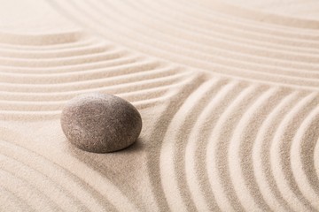 Stone on sand.