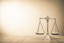 Retro Law Scales On Table. Symbol Of Justice. Vintage Style Sepia Photo