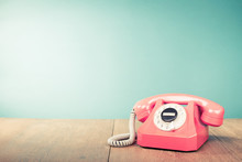 Retro Pink Telephone Front Mint Green Wall Background. Old Style Filtered Photo