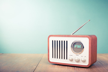 Retro old radio front mint green background. Vintage style filtered photo