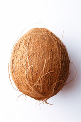 Wall Mural - Coconut on white background. Whole coconut. Top view