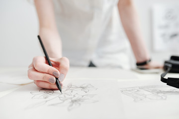 female illustrator drawing sketches
