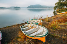Two Wooden Boats On Lake Shore