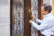 © Per Swantesson/Stocksy - Man locking door of house