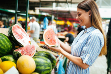 Picture Of Woman At Marketplace Buying Fruits