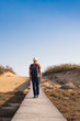 © satura_ - Man traveler with hat and backpack enjoying the natural surroundings.