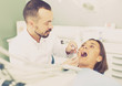 © JackF - Dentist is treating female patient which is sitting in dental chair