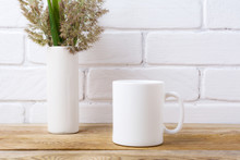 White Coffee Mug Mockup With Grass And Green Leaves In Cylinder Vase