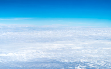 Wall Mural - blue sky and cloud top view from airplane window,nature background