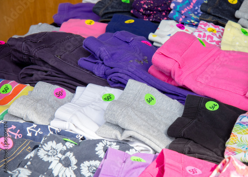 Colorful Clothing With Price Tags At Garage Sale Buy This Stock
