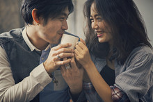Couples Of Asian Younger Man And Woman Happiness Emotion With Hot Coffee Cup In Hand