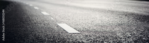 Fotografía black asphalt road and white dividing lines