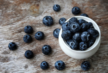 Canvas Print - Blueberry on wooden table background.