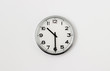 © Peter - White Clock hanging on a white wall showing time 10:30