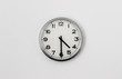 © Peter - White Clock hanging on a white wall showing time 4:30