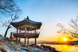 Korean traditional pavilion on the rock by the river in the sunrise