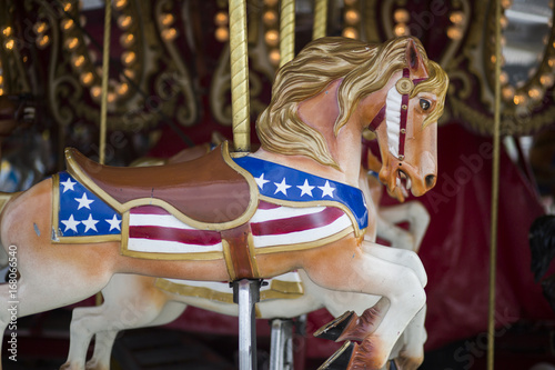 Fotografie, Obraz Horses on Merry Go Round in midway at the Indiana State Fair