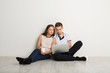 © Prostock-studio - Young couple web surfing on laptop
