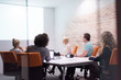 © .shock - Startup Business Team At A Meeting at modern night office building