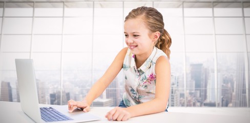 Poster - Composite image of girl using laptop at table