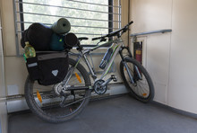 Mountain Bike With Saddlebags Is Transported In The Train.