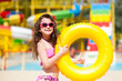 Little beautiful girl goes to the aquapark